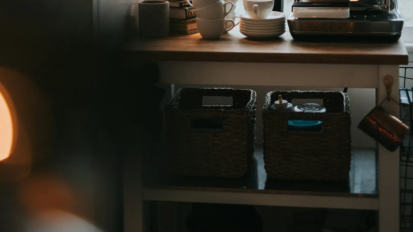 Espresso machine on a kitchen counter by a window
