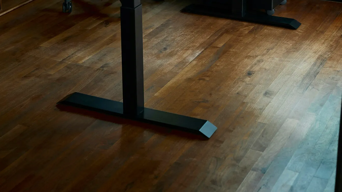 Wooden standing desk and office chair in a home office
